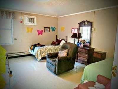 Interior room with two beds and colorful decorations