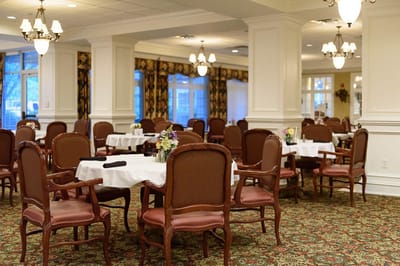 Dining area with tables and chairs, elegant decor