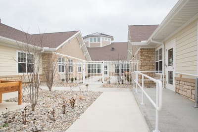 Outdoor pathway leading to the main entrance of the facility