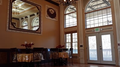 Interior dining area with tables and large windows