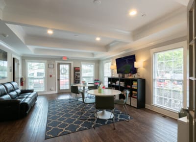 Bright common area with seating and natural light