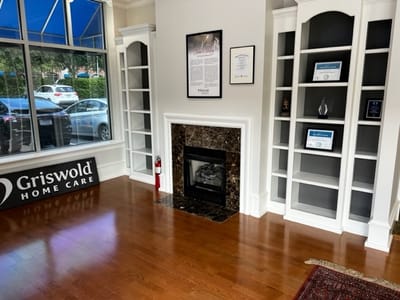 Interior view of Griswold Home Care reception area with logo