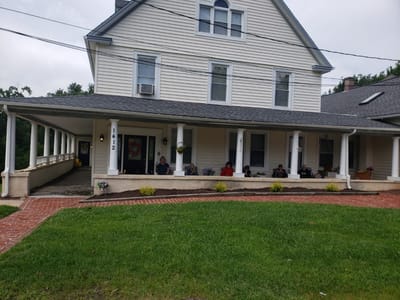 Residents enjoying the porch of the facility.