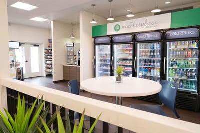 Indoor cafe area featuring vending machines and seating