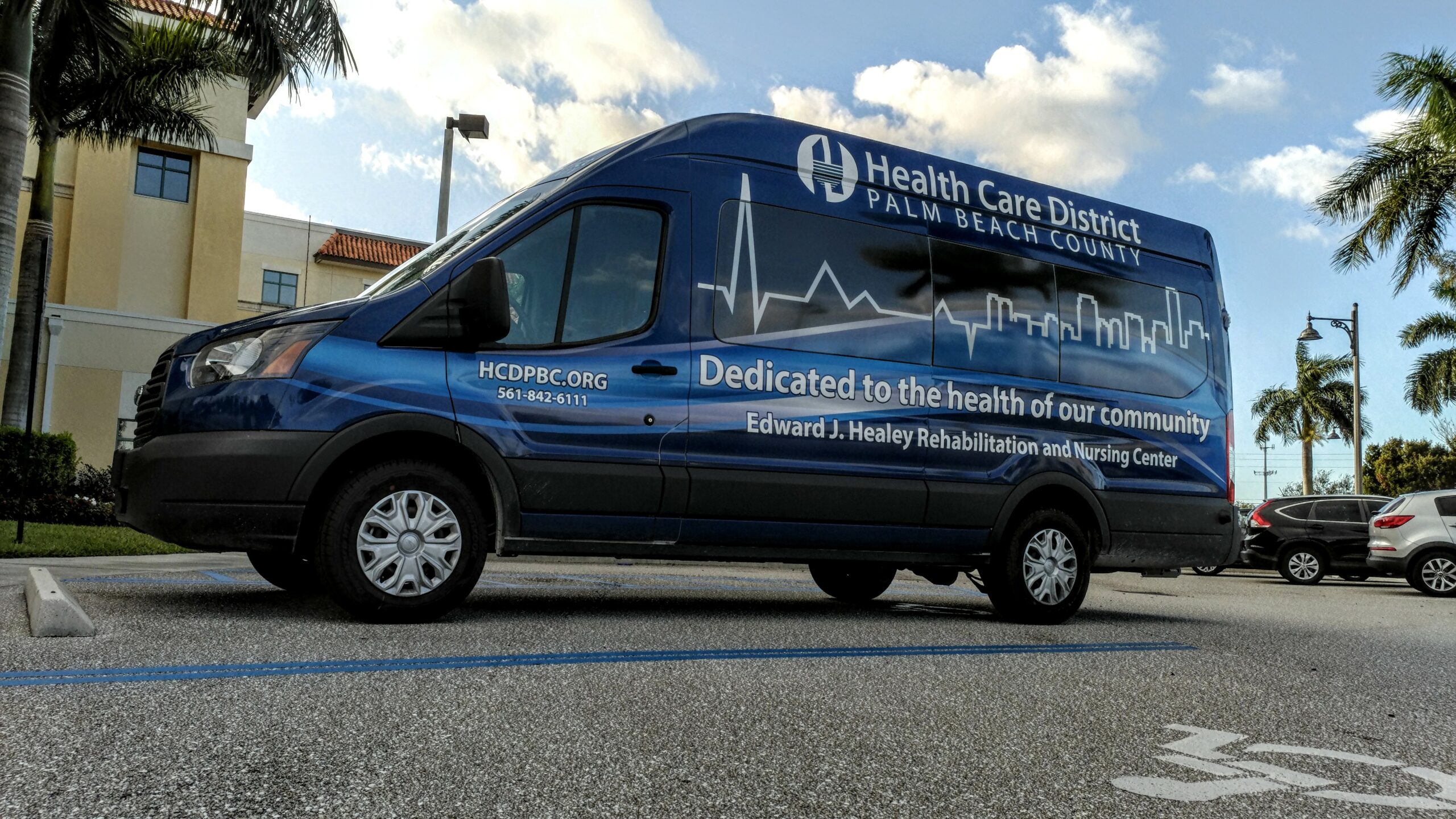 Facility transport van parked in a lot
