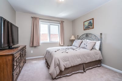 Cozy private room with a bed and dresser