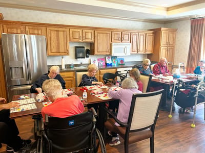 Residents engaged in a bingo activity in a communal space