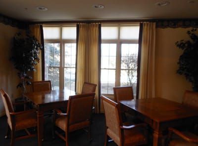 Interior view of a common area with tables and chairs