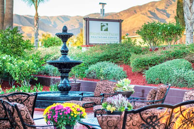 Outdoor space with a fountain and seating area