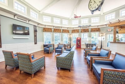 Bright common area with seating and natural light