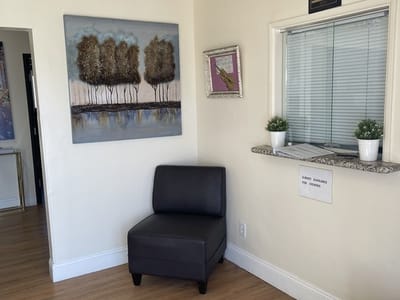 Interior view of a cozy seating area with artwork