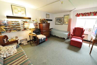 Cozy resident room with furniture and personal items