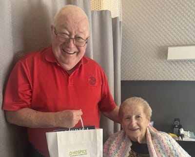 Residents smiling together in a cozy room