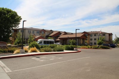 Exterior view of The Woodlake Senior Living facility entrance