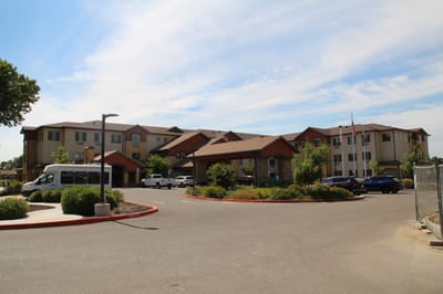 The exterior view of The Woodlake Senior Living facility