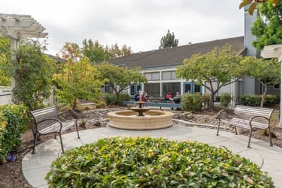 Outdoor area with seating and fountain at the facility