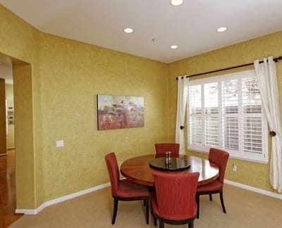 Interior dining area with a round table and chairs