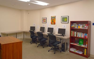 Interior view of a facility computer room with desks