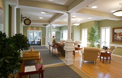 Bright common area with seating and plants