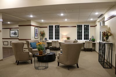 Interior lounge area with comfortable chairs and lighting