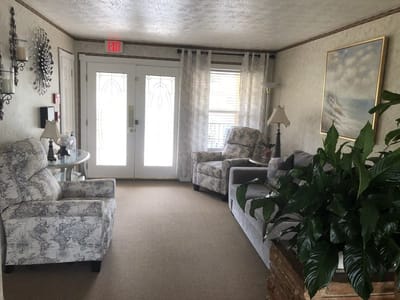 Bright and cozy common area with seating and plants