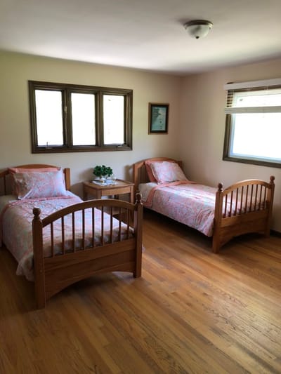 Bedroom with two beds and natural light