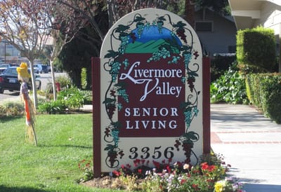 Sign for Livermore Valley Senior Living with landscaping