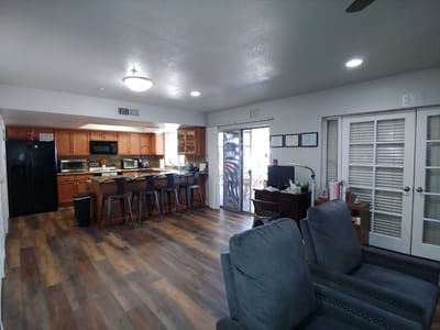Bright common area with kitchen and seating