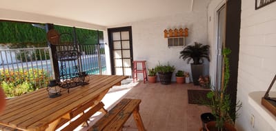 Outdoor seating area with plants and decor