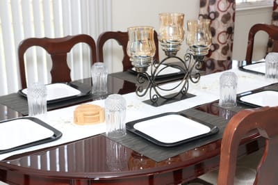 An elegantly set dining table in a facility dining area