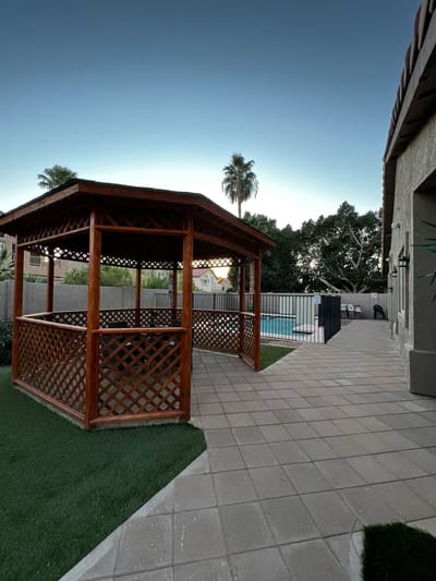 Outdoor gazebo with a pool view in a senior living facility