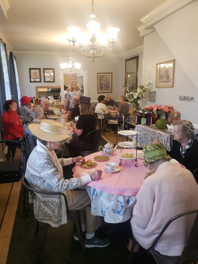 Residents enjoying afternoon tea in a common area