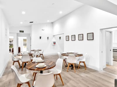 Bright dining room with modern tables and chairs