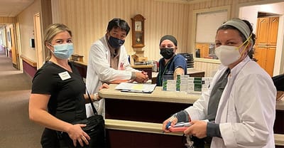 Staff interacting at the nursing home reception area