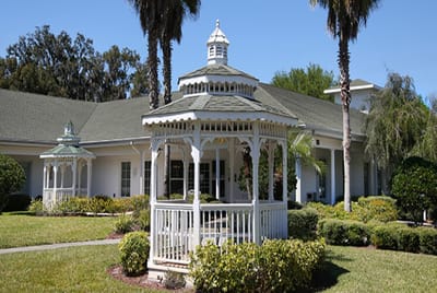 Outdoor gazebo surrounded by well-maintained gardens