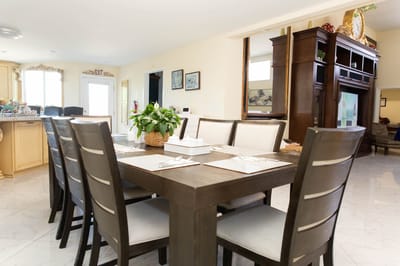 Dining table set up in a bright dining area