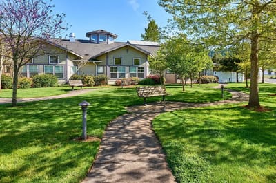 Outdoor space with benches and a pathway near the facility