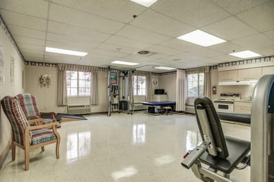 Interior view of a therapy room with gym equipment