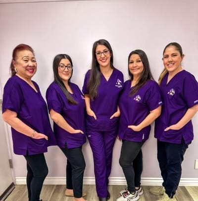 Staff members posing together in scrubs