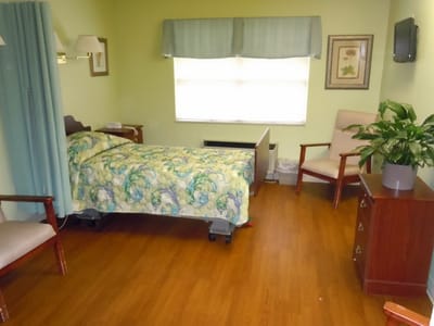 Cozy private room with a bed and seating area