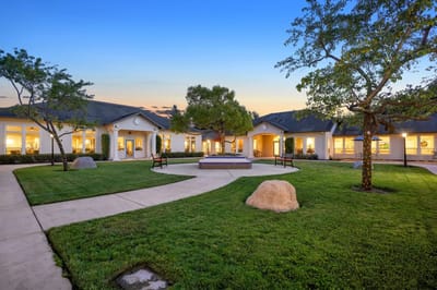 Beautiful courtyard with green grass and trees