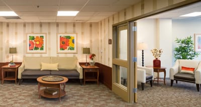 Bright and welcoming common area with seating and decor