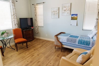 Cozy resident room with bed and seating area