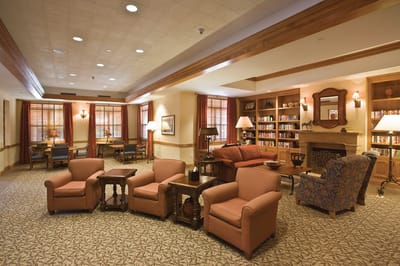 Cozy common area with seating and bookshelves