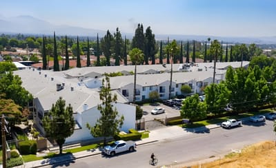 Aerial view of Parkside Senior Apartments with surrounding greenery