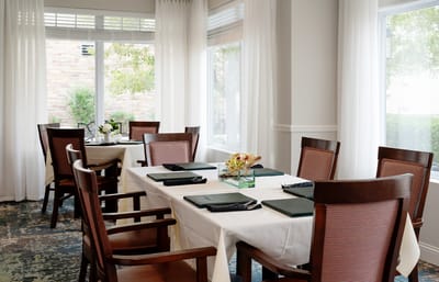 Quiet dining area with tables and chairs set.