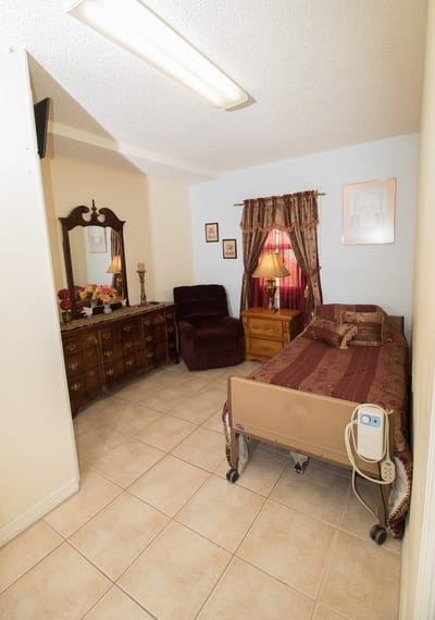 Private resident room with bed and furniture