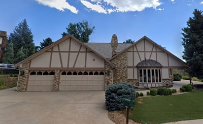 Exterior view of a residential building with landscaped yard