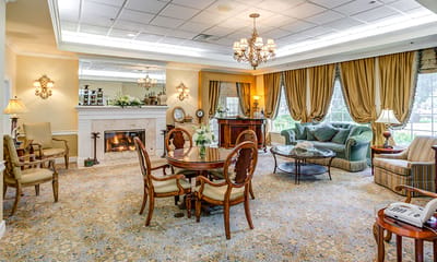 Cozy common area with seating and a fireplace