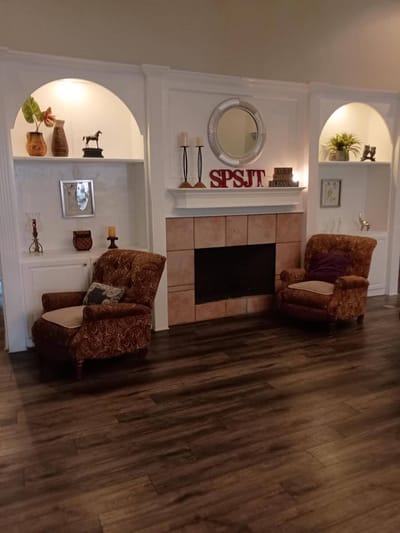 Cozy lobby area with armchairs and decorative fireplace